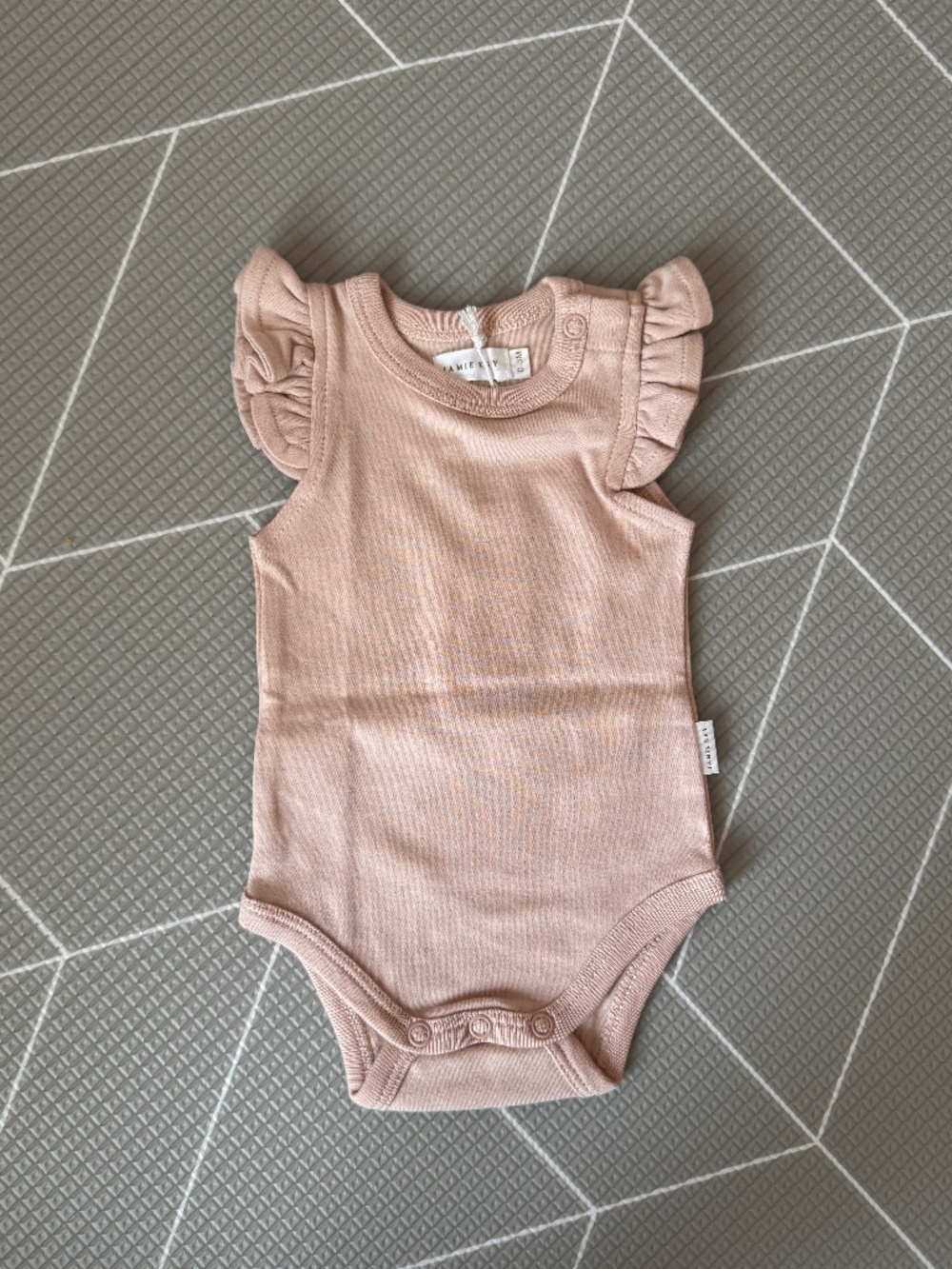 Jamie Kay flutter sleeve onesie